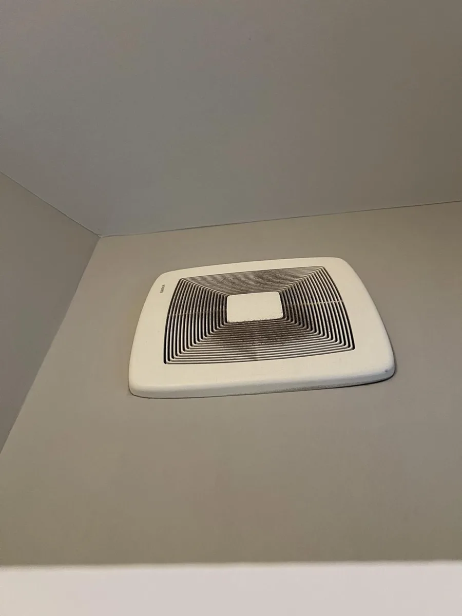 Bathroom exhaust grille before cleaning