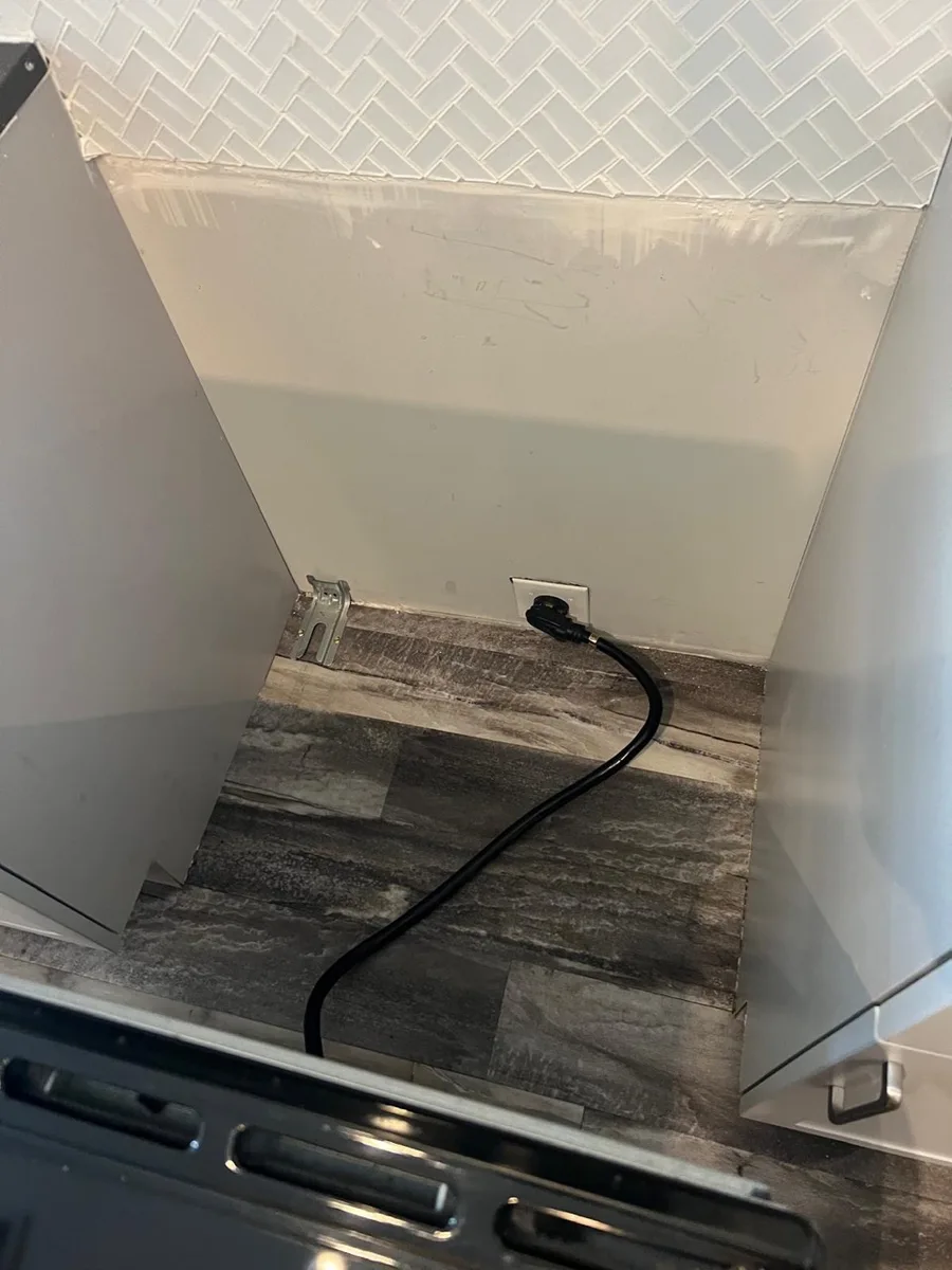 Floor and wall behind the stove